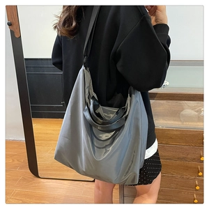 Grey purple large capacity waterproof nylon tote bag shown in casual lifestyle setting