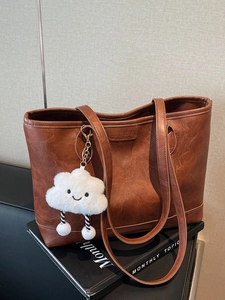 Vintage brown PU leather tote bag with a white cloud plush charm for daily commuting