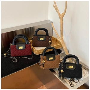 Detailed display of four quilted chain bags in burgundy, brown, tan, and black leather