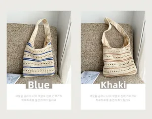 Detail of striped crochet shoulder bags with hollow weave and smooth inner lining