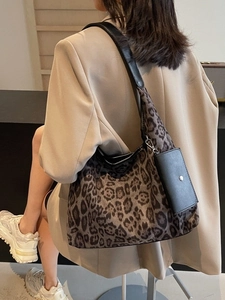 Large vintage leopard print tote bag with black leather strap and small detachable pouch