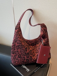 Retro leopard print tote bag with small hanging pouch on a minimalist background