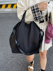 Black large capacity waterproof nylon tote bag with adjustable shoulder strap and handles