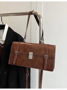 Caramel brown vintage shoulder bag in glossy faux leather with silver buckle detail