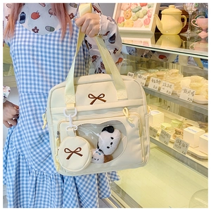 Cream canvas ita bag with transparent window, bow embroidery and small round pouch