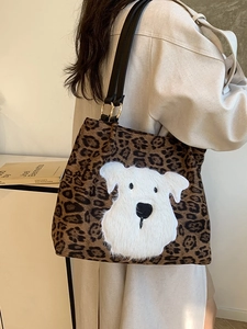 Leopard print tote bag with plush puppy patch and black faux leather straps