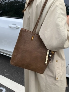 Vintage brown leather tote bag with tassels for women, minimalist autumn shoulder handbag