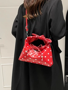 Retro red crossbody bag with white polka dots and a knotted handle for women