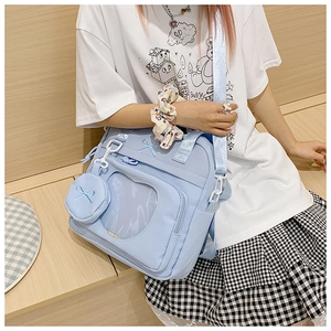 Light blue nylon ITA bag with heart-shaped window and matching bow purse pendant detail