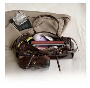 Deep brown oil wax leather bag interior showing large capacity for essentials