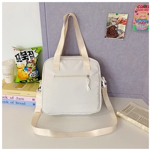 Spacious white canvas crossbody bag with zipper pocket for school and daily commute