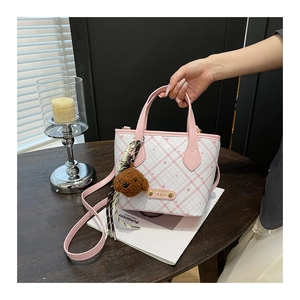 Pink and white checkered tote bag with a cute brown teddy bear plush charm detail