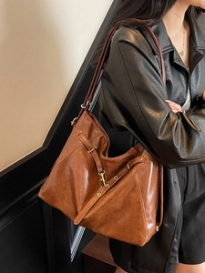 Brown vintage faux leather tote bag with adjustable shoulder straps for daily use