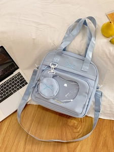 Light blue canvas tote bag with clear display compartment and bow embroidery