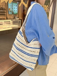 Women's hollow woven shoulder bag with blue stripes and casual bucket design