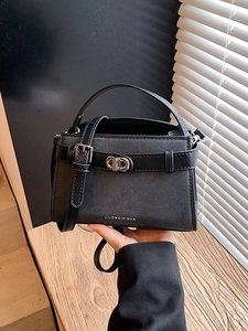 Crossbody bucket bag in black cross-grain leather with silver buckle and top handle
