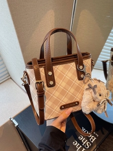 Chic color-block mini bucket bag with checkered pattern and plush rabbit pendant