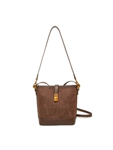 Brown patchwork bucket bag with suede texture and adjustable shoulder strap in minimalist style