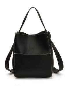 Minimalist black leather bucket bag with contrasting white stitching and dual straps