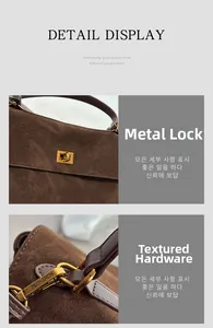 Detail des goldenen Drehverschlusses und der gravierten Metallschnalle der Wildledertasche