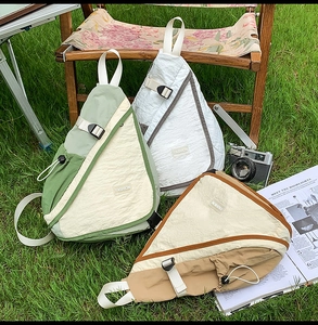 Outdoor crossbody bag details featuring waterproof nylon fabric and buckle strap design