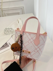 Pink and white checkered bucket bag with leather handles and cute teddy bear charm