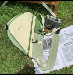 Detail of waterproof nylon crossbody bag with fashion logo and adjustable buckle strap