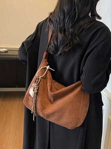 Retro brown suede hobo tote bag for women with cute white plush charm and stitching details