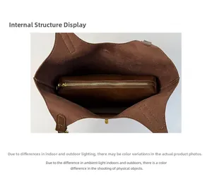 Top view of the brown leather bucket bag showing internal space and zippered inner pouch
