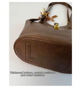 Macro detail of the thickened brown leather bottom with scratch-resistant stitching