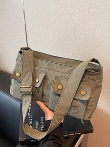 Army green multi-pocket nylon shoulder bag with vintage buckles and adjustable strap