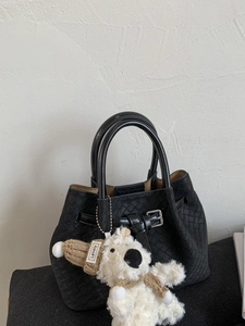 Fashionable black woven bucket bag with silver buckle and cute plush bear charm decoration