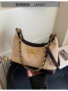 Vintage khaki quilted shoulder bag with chain strap and retro gold buckle detail