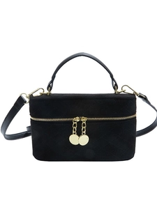 Black quilted suede crossbody bag with gold metal handle and dual zipper design