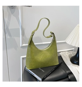 Detail of olive green crescent hobo bag with adjustable strap and silver metal buckle