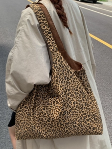 Vintage leopard print canvas tote bag featuring large capacity and wide shoulder straps