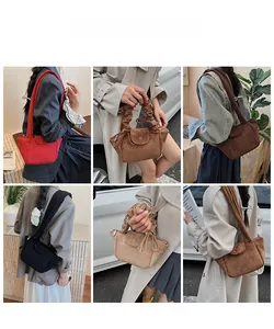 Detailed views of vintage faux suede pleated shoulder bags in six various fall colors