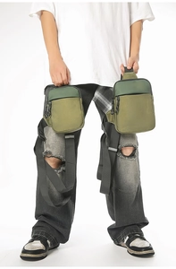 Detailansicht der taktisch grünen Nylontasche mit Multi-Taschen-Struktur und Reißverschluss