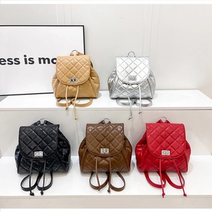 Multiple colors of quilted leather backpacks with silver twist-lock and drawstring detail