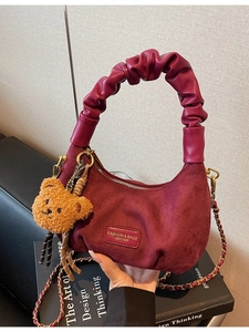 Vintage burgundy suede dumpling bag with pleated handle and cute bear charm