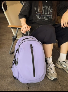 Detailed side view of light purple waterproof backpack with adjustable buckles and side pockets