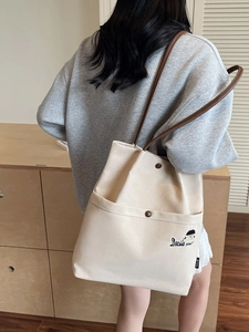 Canvas tote bag in beige with dark brown straps and cute embroidery for daily wear