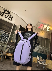 Detail of lavender purple backpack with black vertical zipper and durable nylon fabric