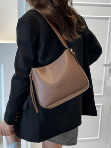 Minimalist brown matte leather bucket shoulder bag with New York text for women