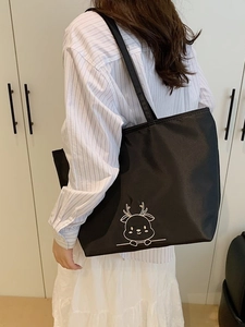 Black canvas tote bag with embroidered deer pattern for school and office use