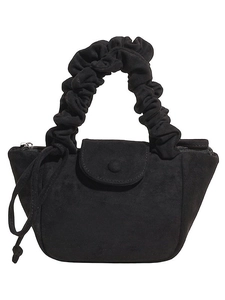 Minimalist black faux suede crossbody bucket bag with ruched handle and button closure