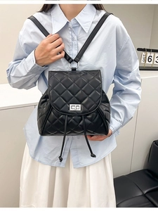 Chic black quilted leather backpack with silver turn-lock for stylish daily travel