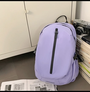Lavender travel backpack with black vertical zipper pocket and side buckle detail