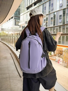 Waterproof purple nylon casual backpack for women with vertical zipper in urban setting