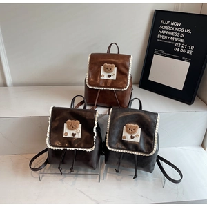 Retro style mini backpacks with lace trim and bear patch, shown in three vintage colors